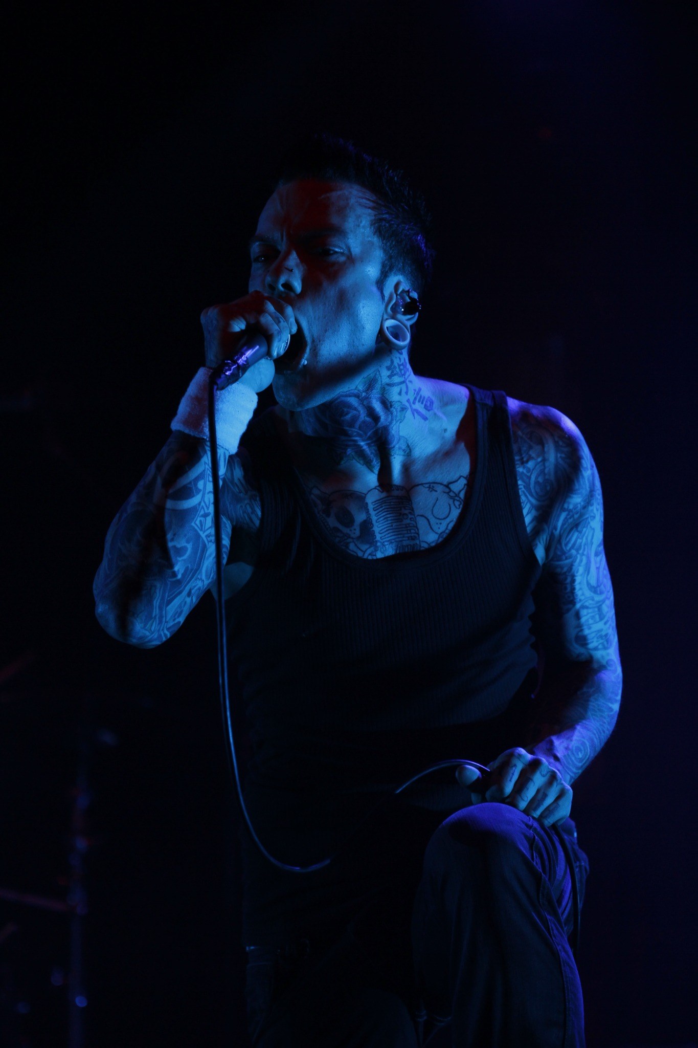 Concert performer under blue stage light